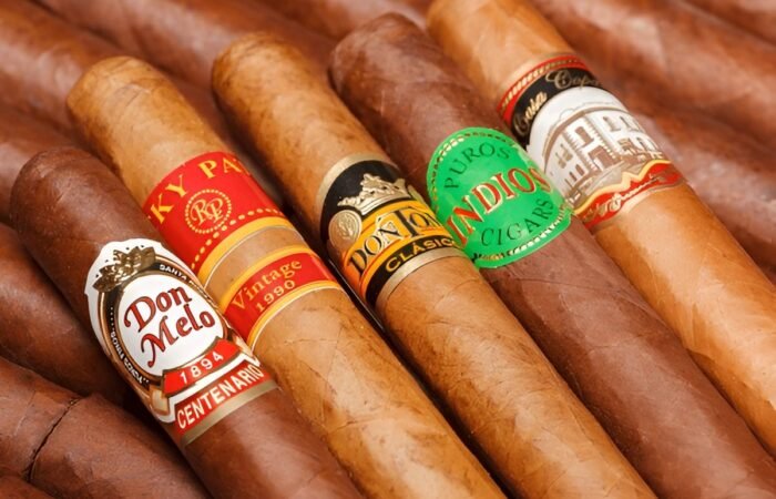 Real vs fake cigars comparison authentic Cuban cigar next to counterfeit