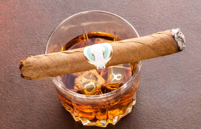 high angle whiskey with ice cigar