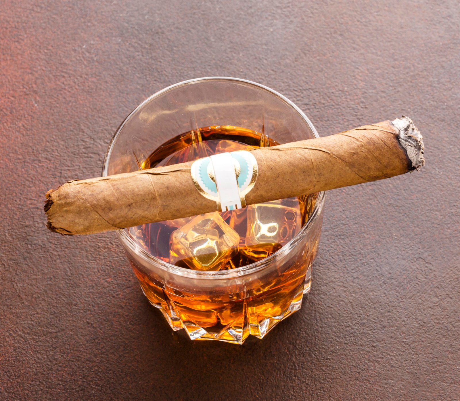 high angle whiskey with ice cigar